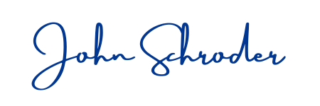 The text 'John Schroder' written in blue cursive script.