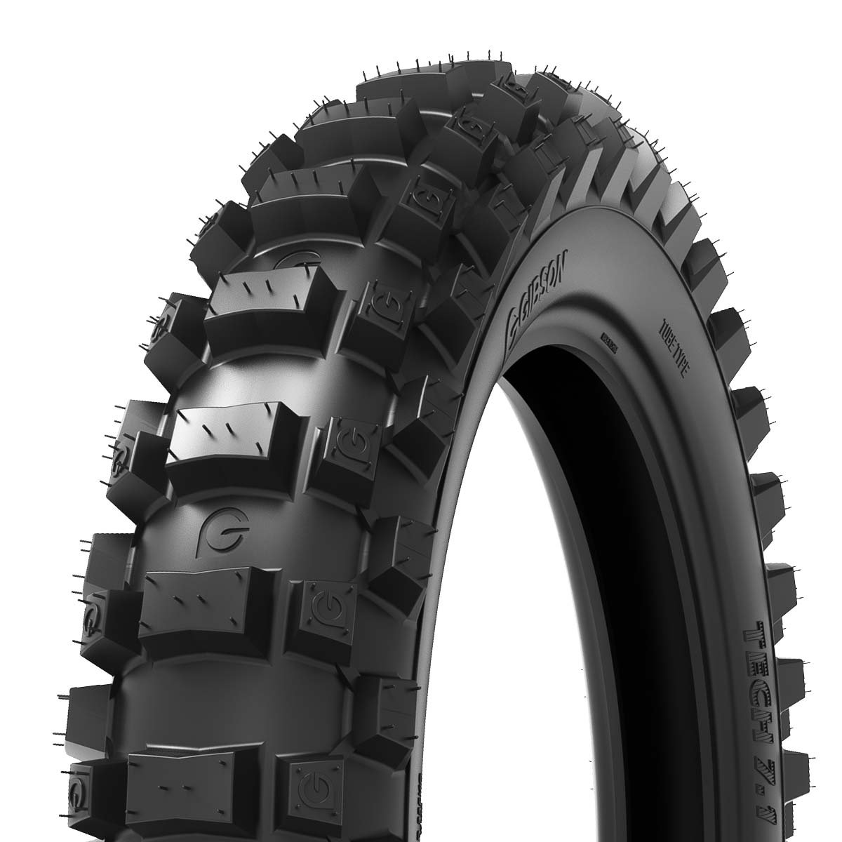 Close-up of a black off-road tire with large tread blocks and deep grooves.