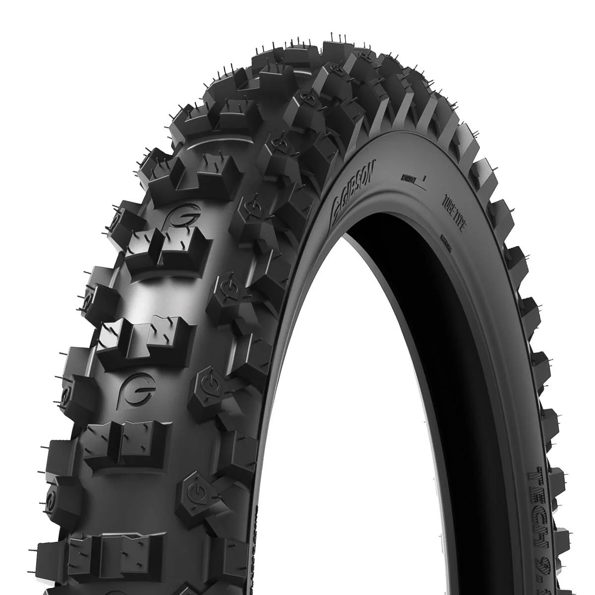Close-up of a black off-road motorcycle tire with large, deep treads.