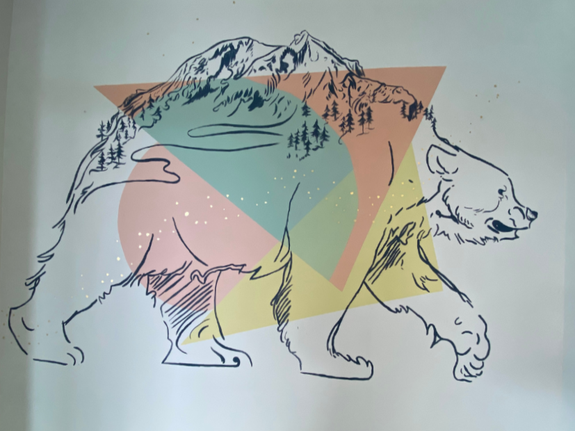 Illustration of a walking bear outlined with layered mountain and forest imagery in soft geometric colours.