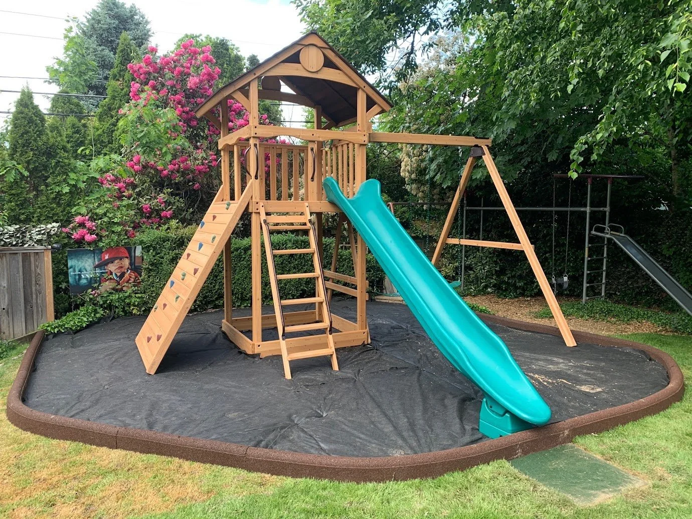 OOXL with swings, rock wall and slide.jpg