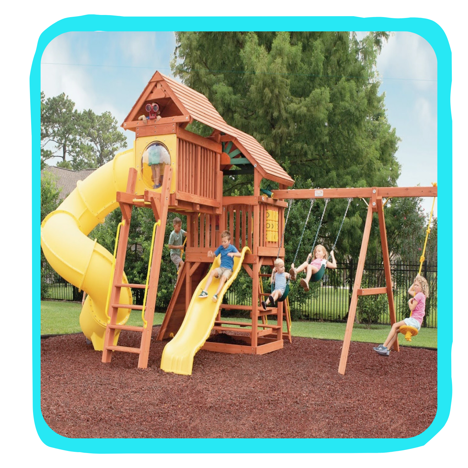 Children playing on a colorful wooden playground set with slides, swings, and a spiral tunnel, on a soft mulch surface in a park.