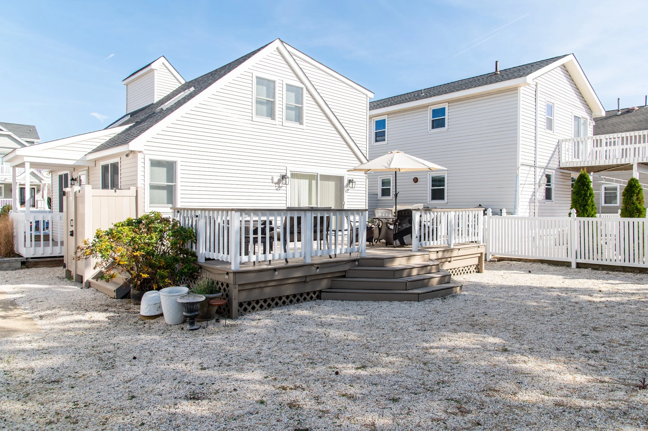 Outdoor shower to the left of the house