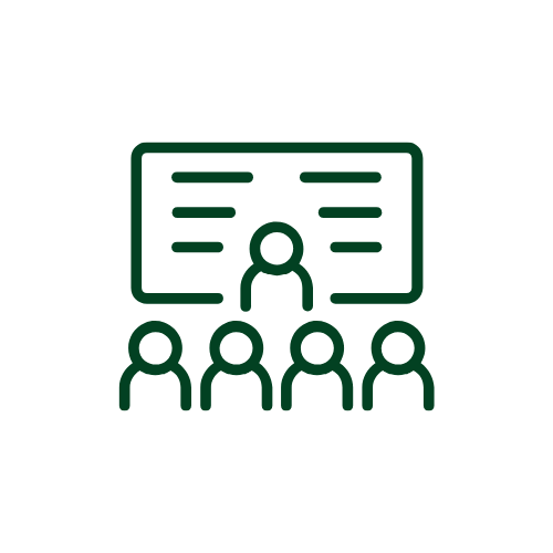 Icon of a teacher or presenter standing in front of a blackboard with four students seated and facing the blackboard.