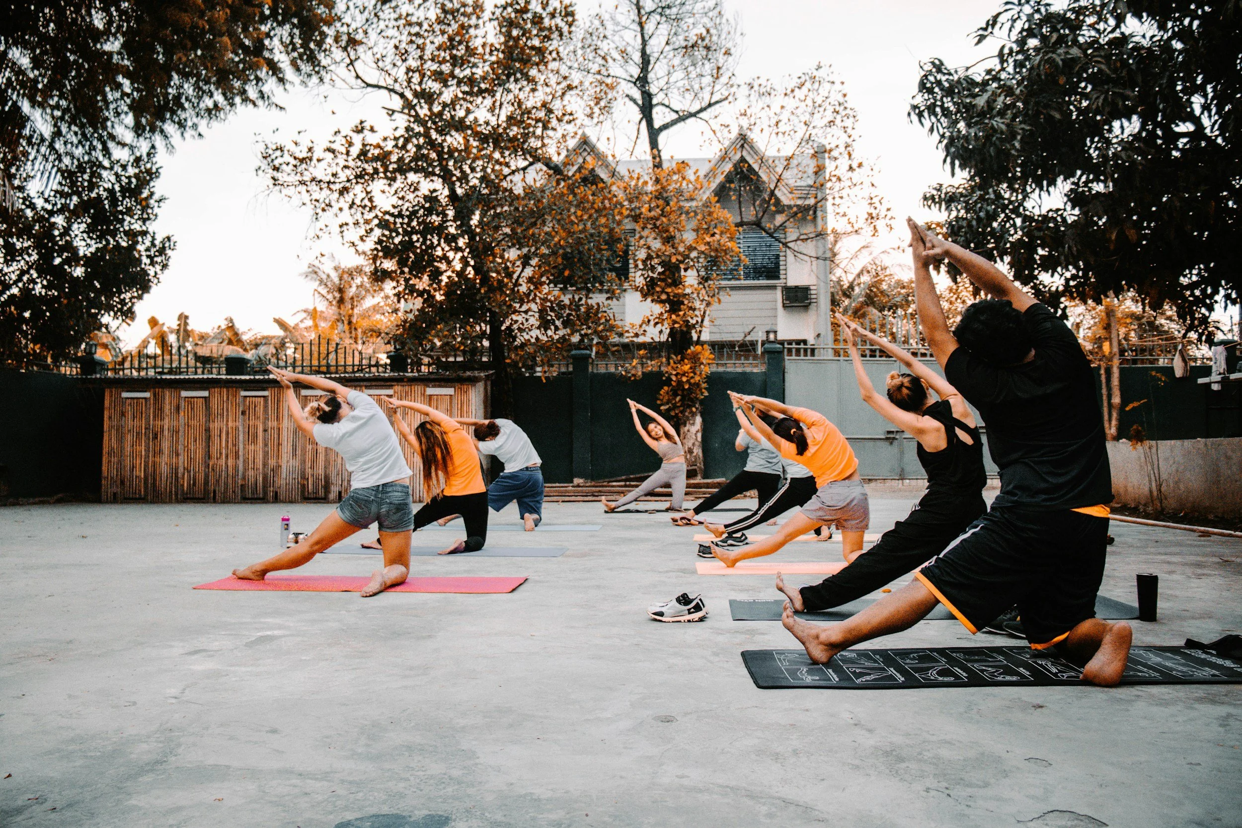 Apartment residents taking part in a professionally led courtyard yoga class.