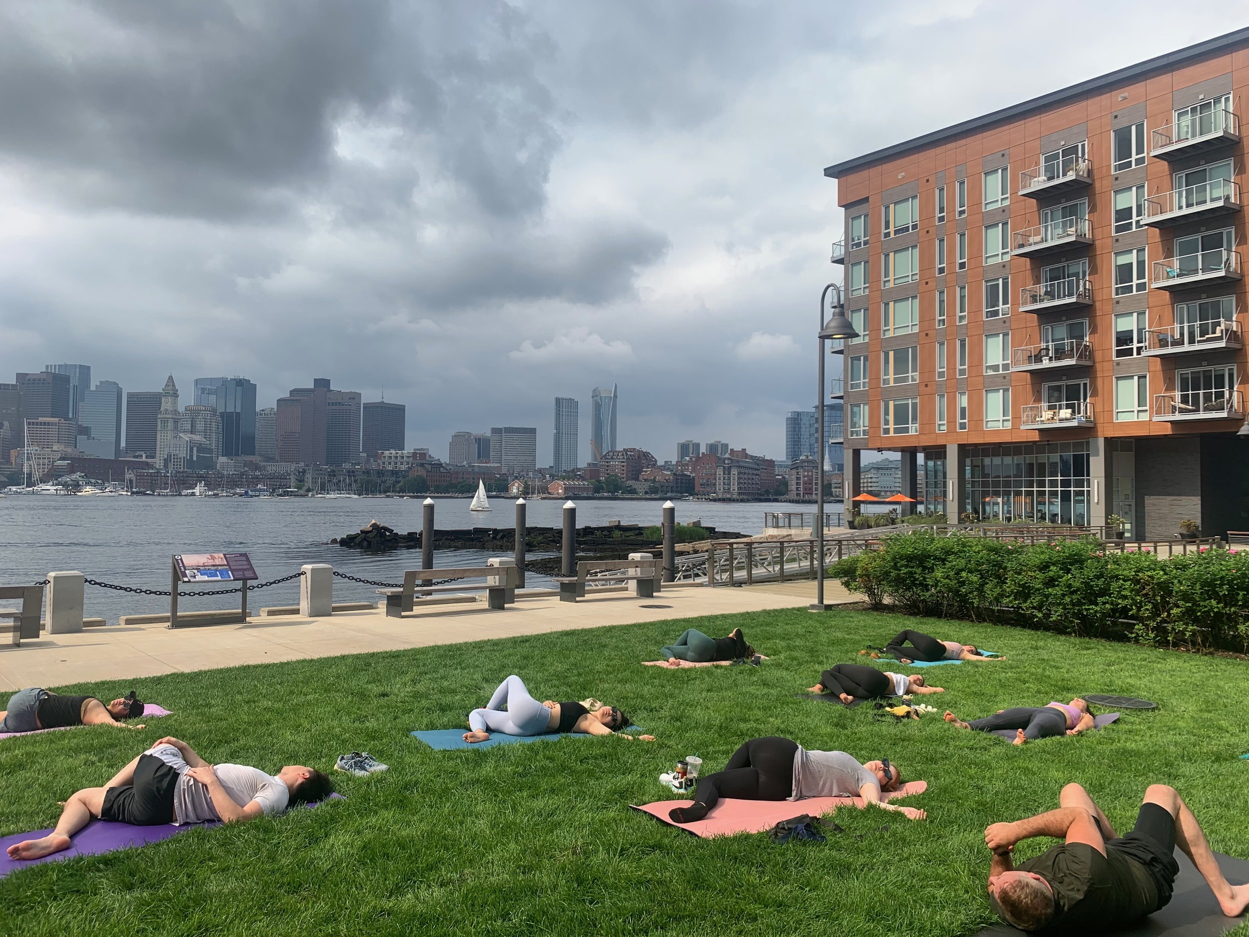 Apartment residents participating in a Saturday morning outdoor yoga class.