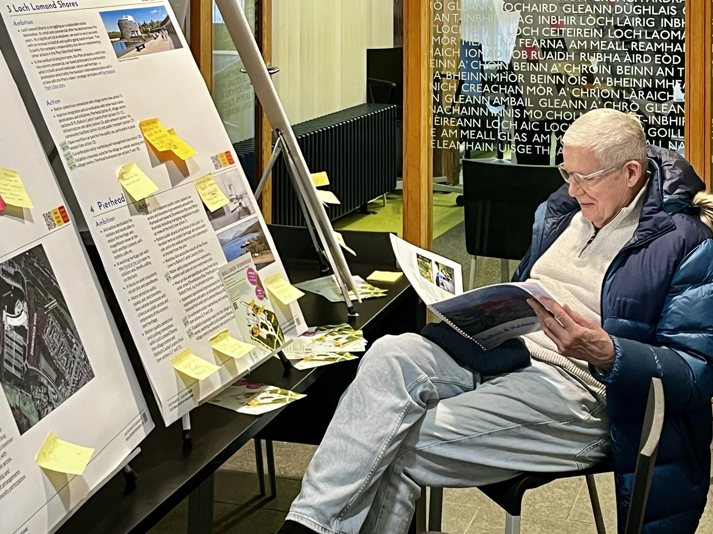 man reading the draft plan at the event