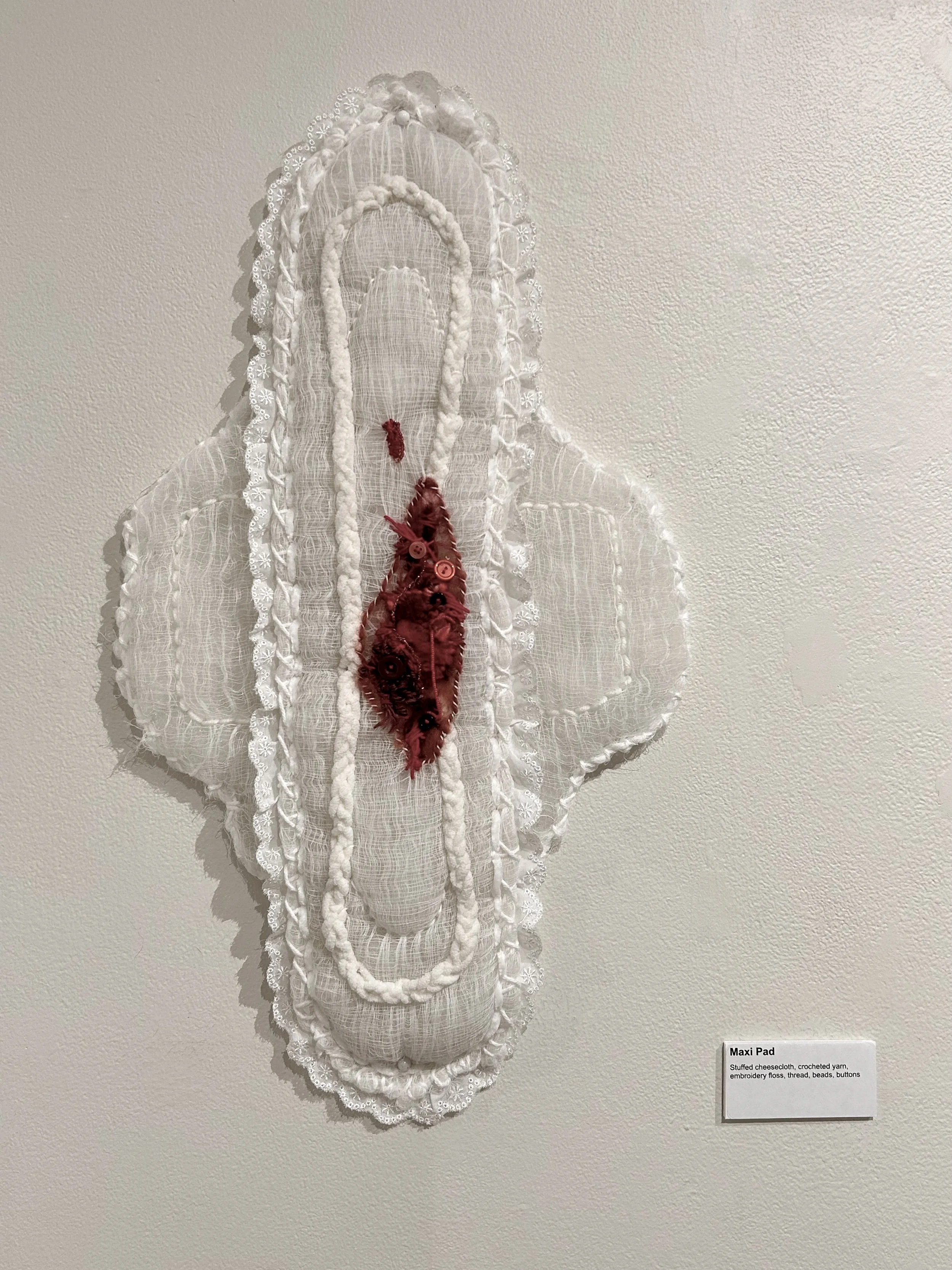 "Maxi Pad" cheesecloth, crocheted yarn, beads, buttons, cotton fibers, lace, 2024