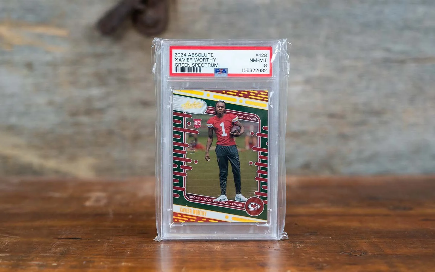 2024 Absolute Green Spectrum Xavier Worthy Trading Card - Graded 8