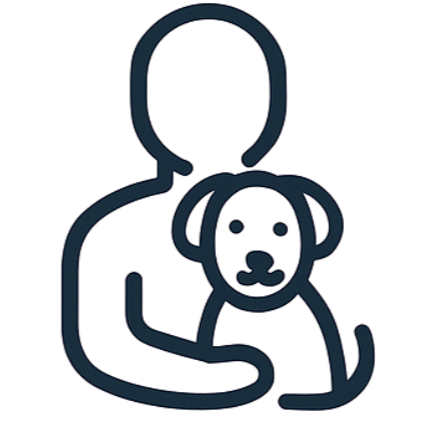 Silhouette of a person holding a puppy