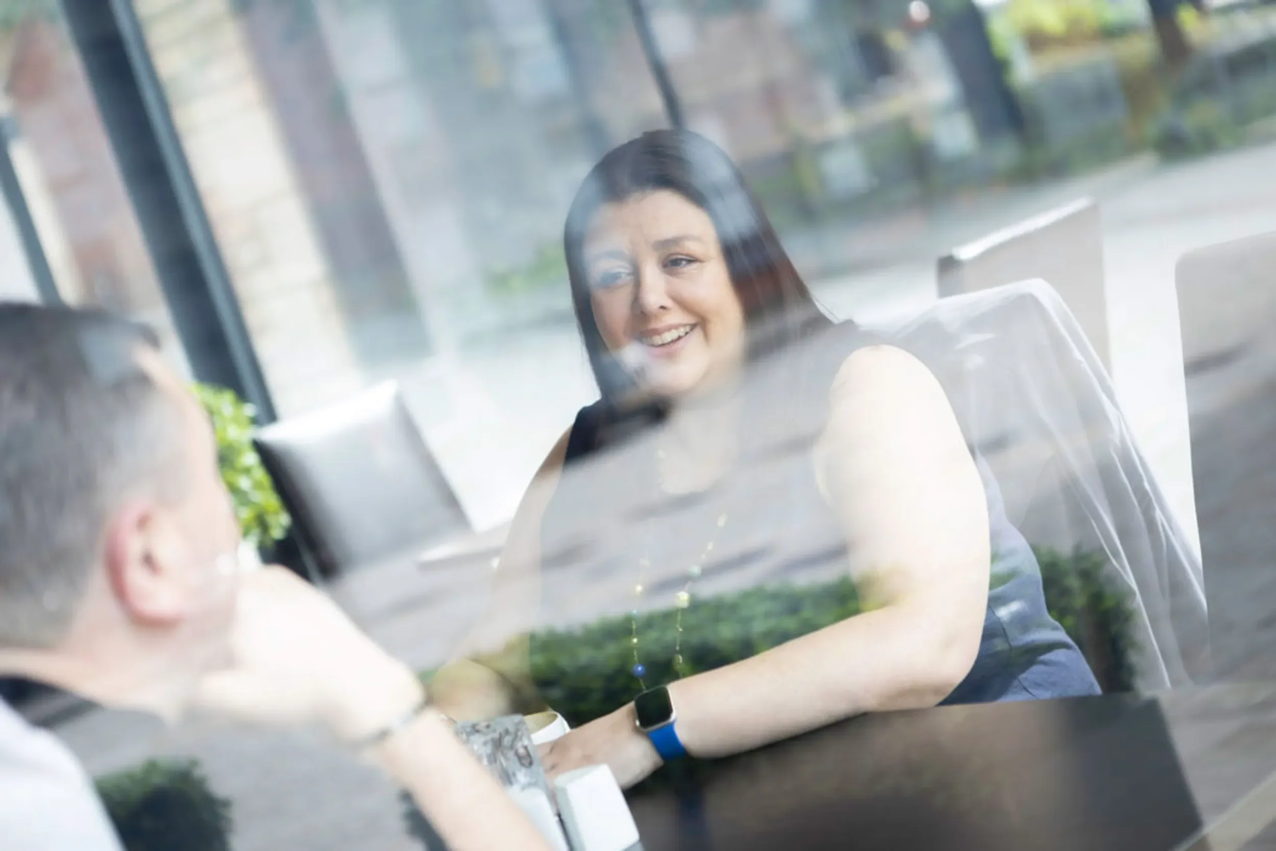 A course tutor smiling and teaching to students at Three Pillars Training centre, Lincoln.
