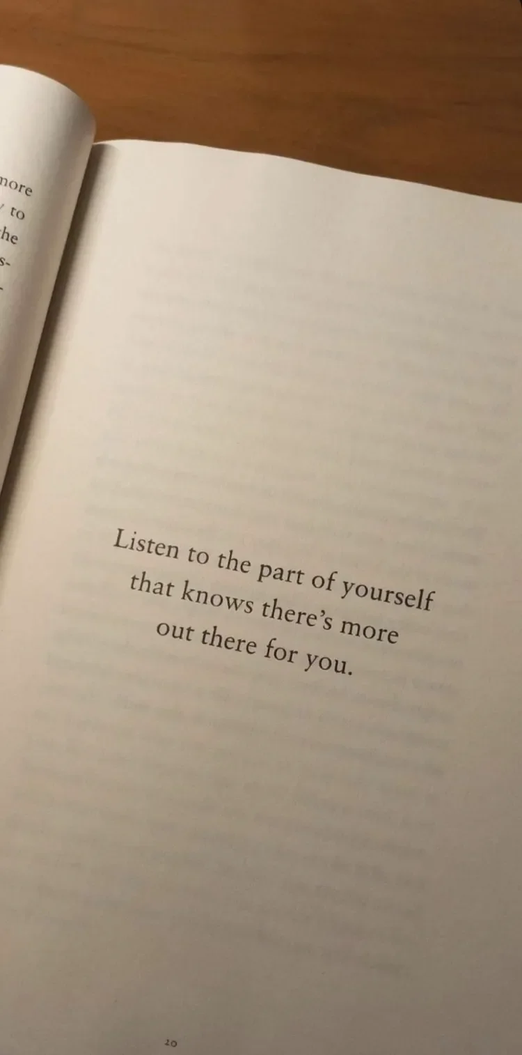 Image of an open book with "Listen to the part of yourself that knows there's more out there for you."