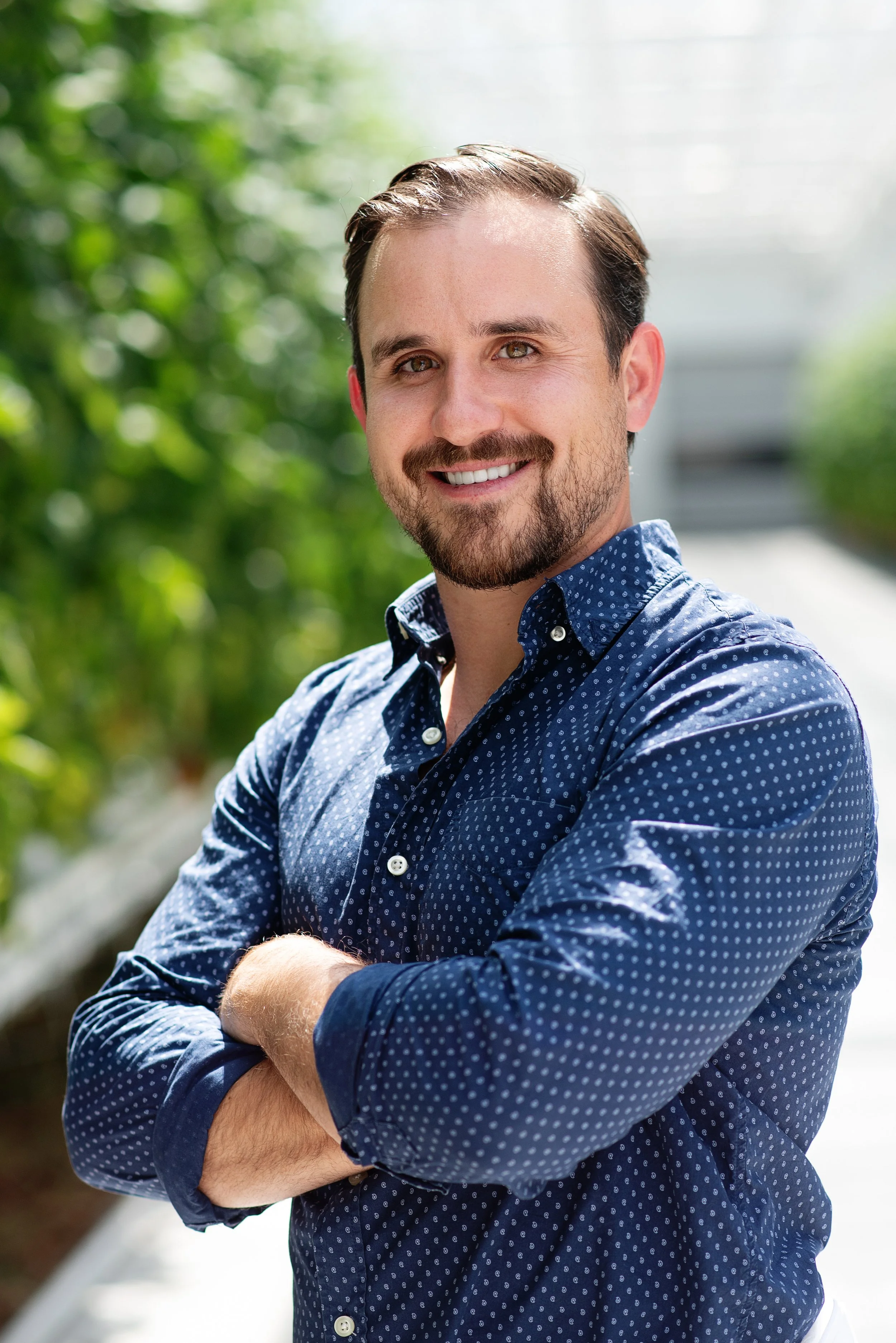 Micah Butler of Pacific Coast Greenhouse Technologies inside a commercial greenhouse facility