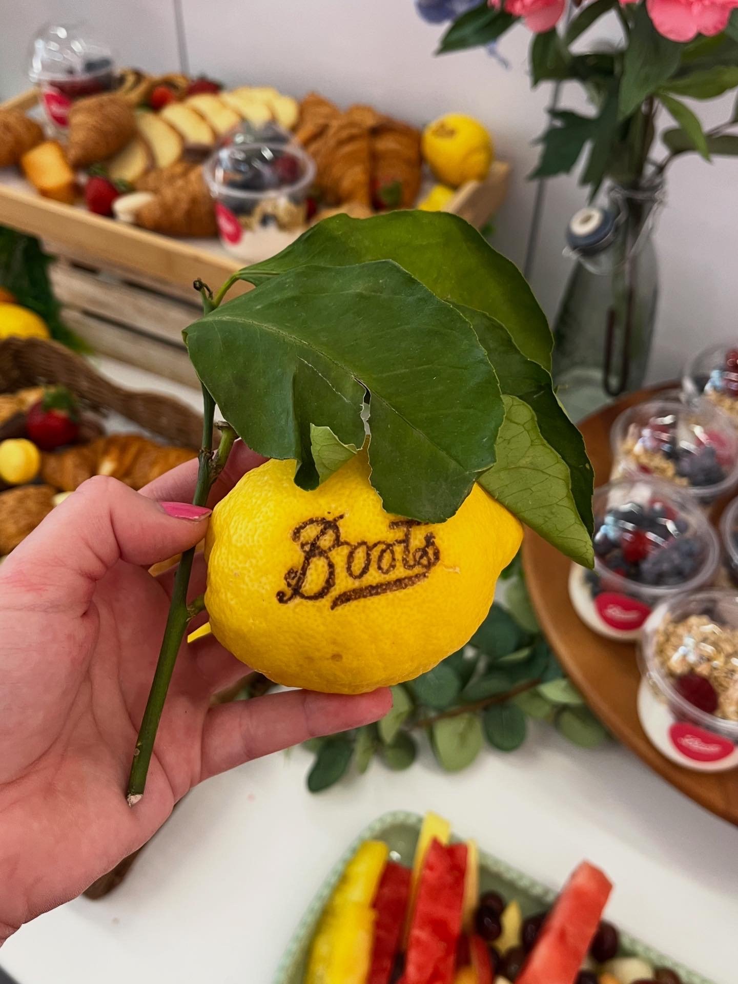 Boots logo branded onto a lemon