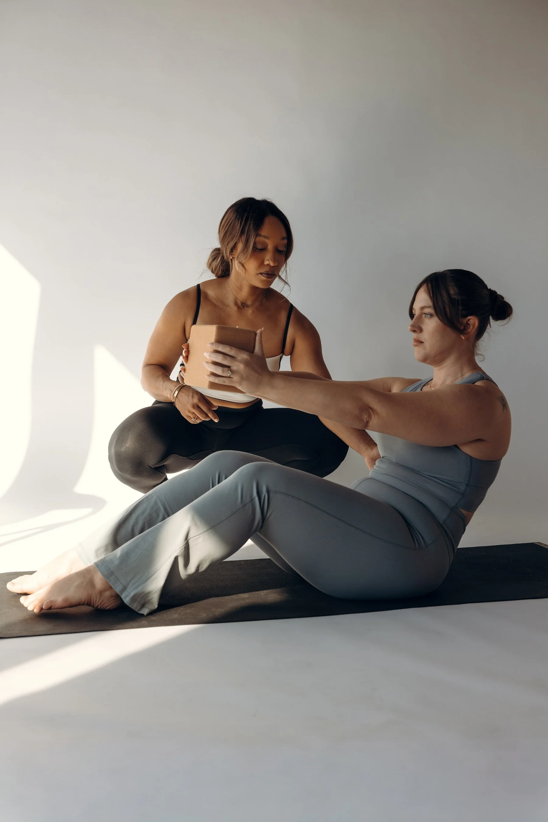 Santé founder Aissata Himmelfarb supporting a client during a private wellness, movement, and fitness session.