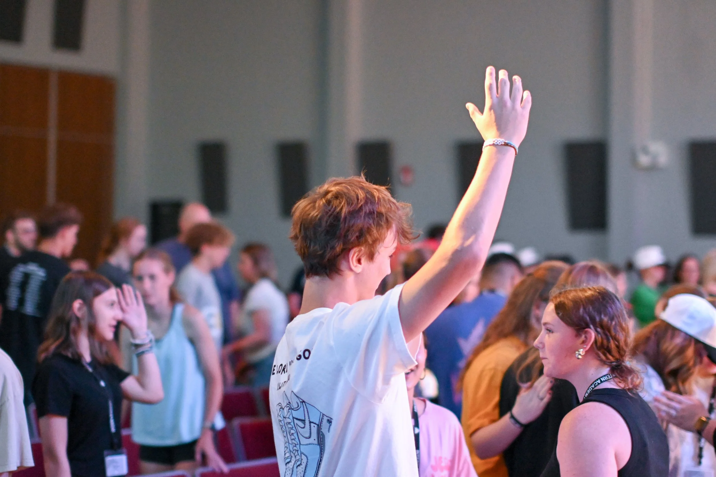 Students worshiping at an Intern Academy event
