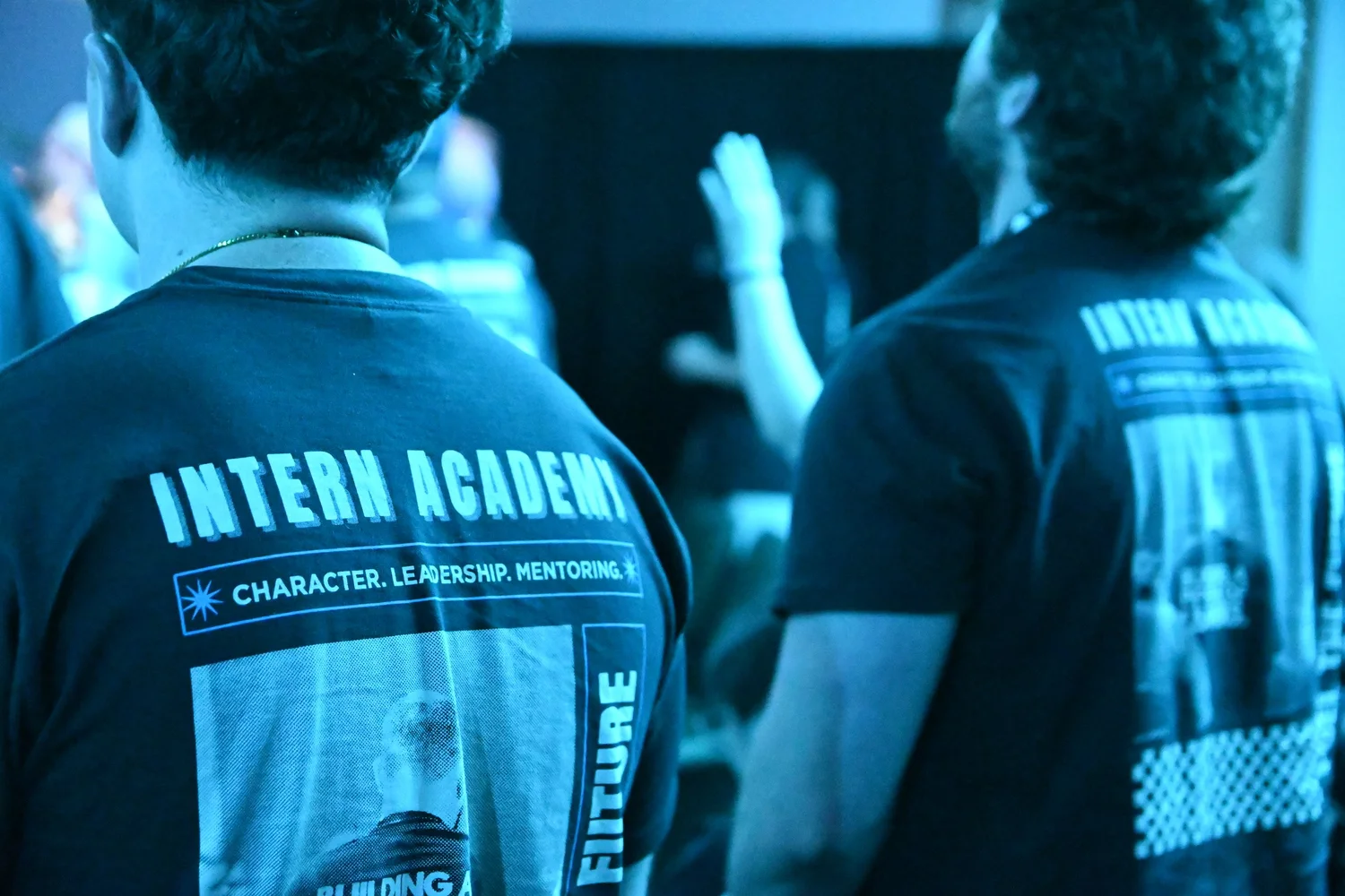 Interns wearing Intern Academy shirts