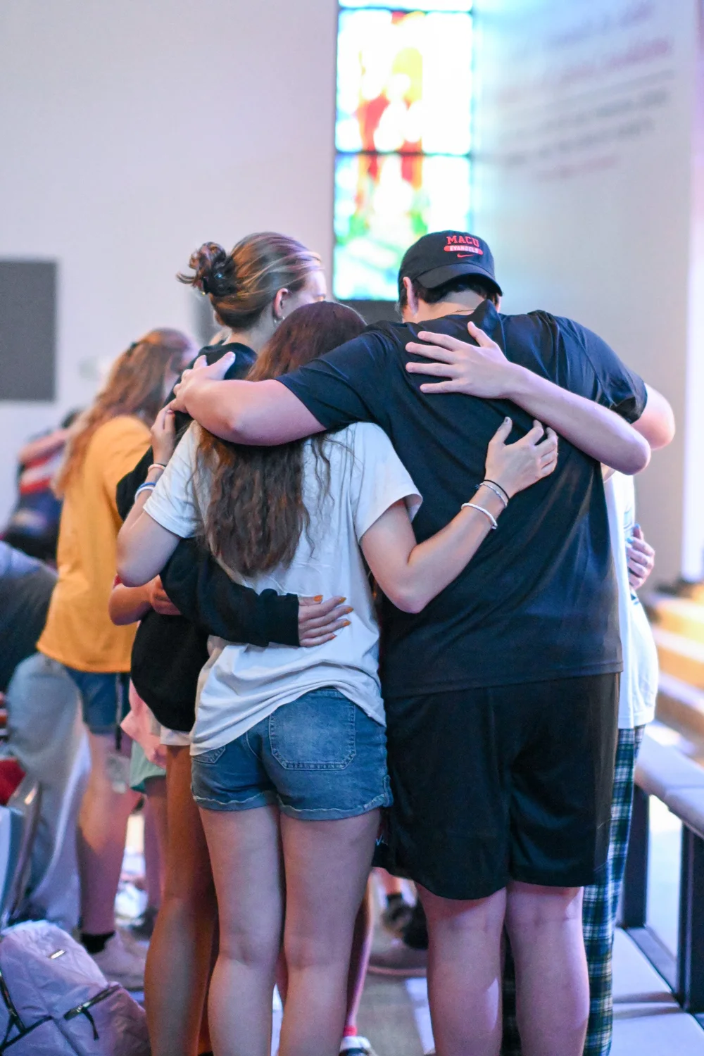 Students embracing in a group hug