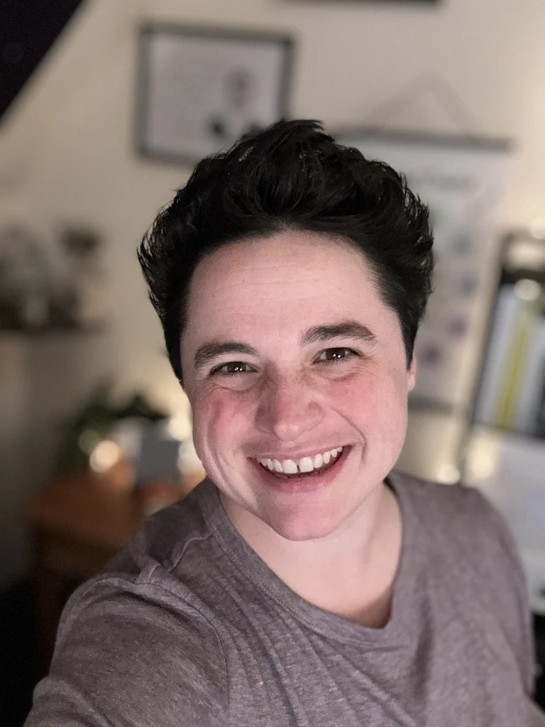 Jen Jordan, licensed clinical social worker (LCSW/LICSW), smiling in her home office