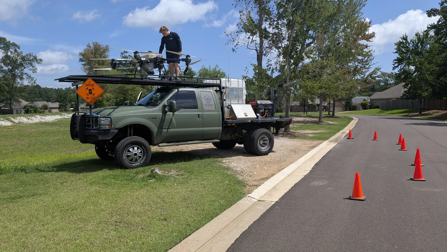 Shadow Vet Drone Ops truck and agricultural spray drone deployed at the Pinebrook vegetation-control jobsite