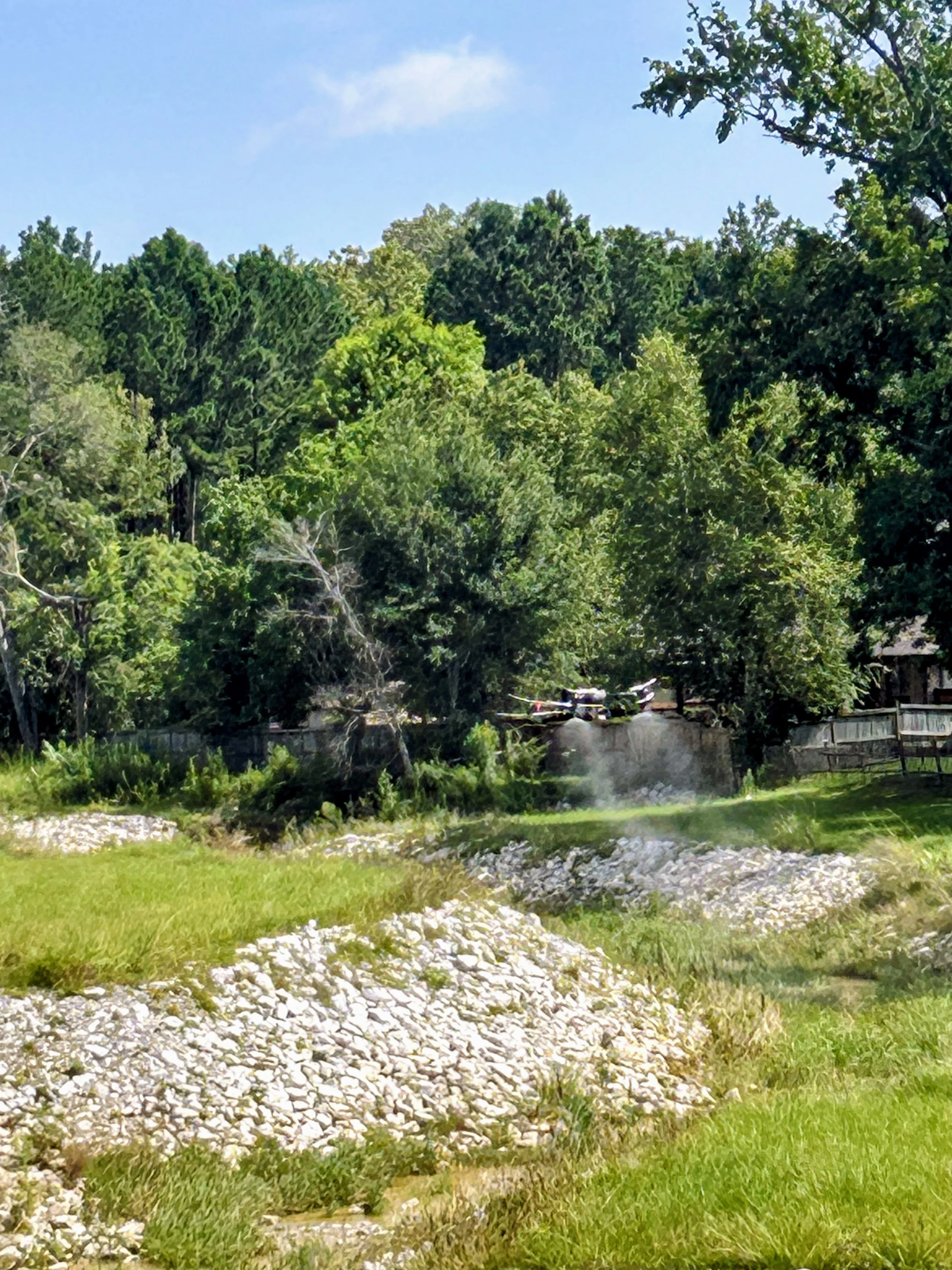 T50 Spraying Drainage Ditch in Pinebrook Neighborhood