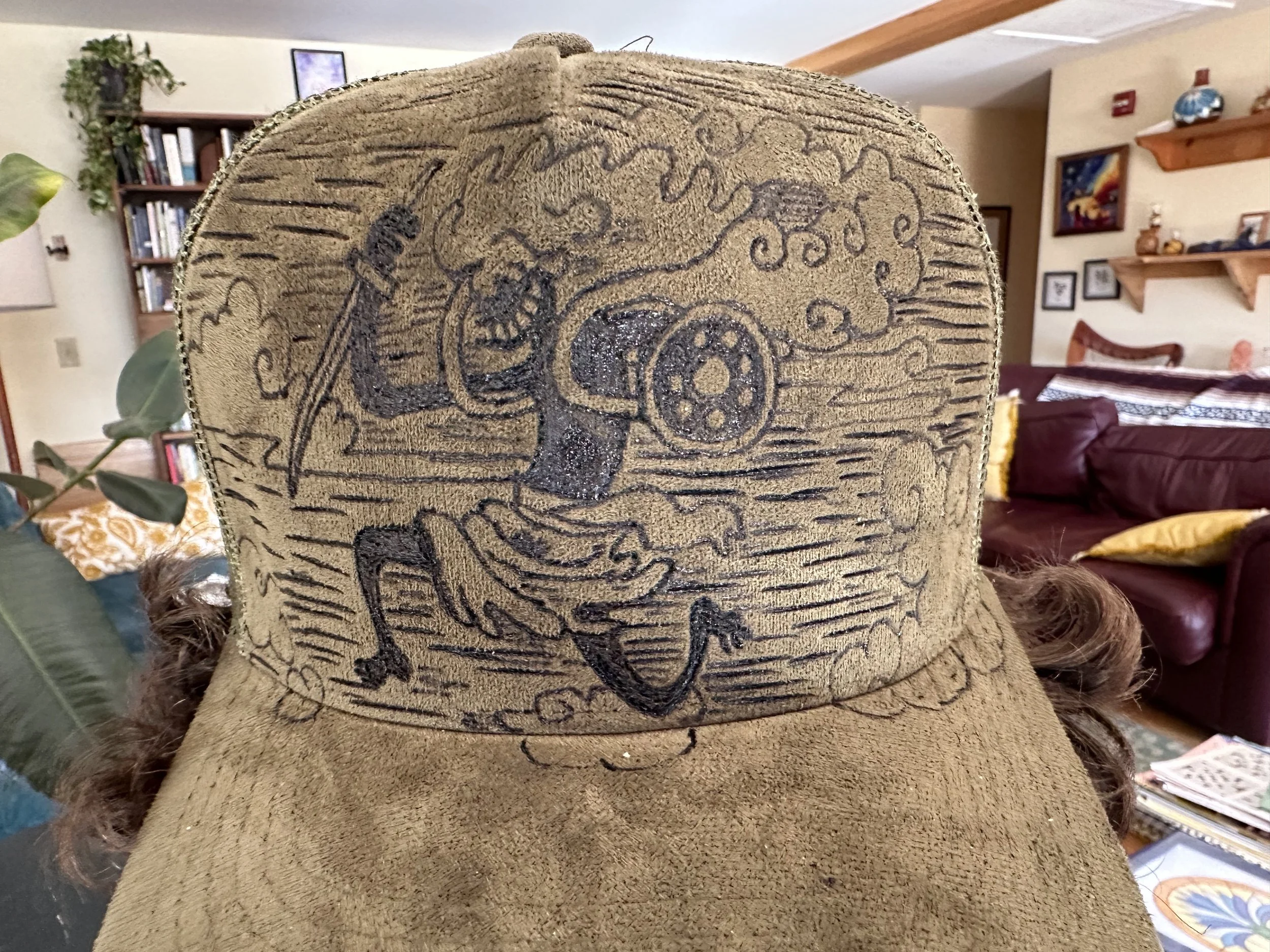 A custom designed vegan suede forest green trucker cap with Nike the Sun God from One Piece