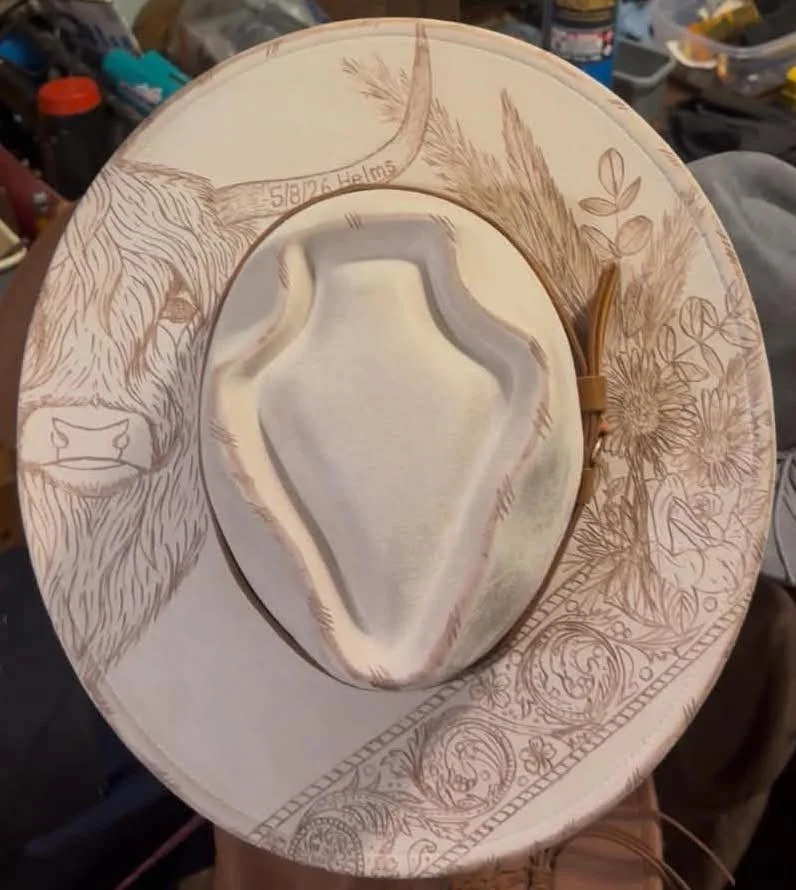 Hand burned custom hat on a arrow head vegan suede rancher fedora. Featuring a highland cow, wedding bouquet and lace design