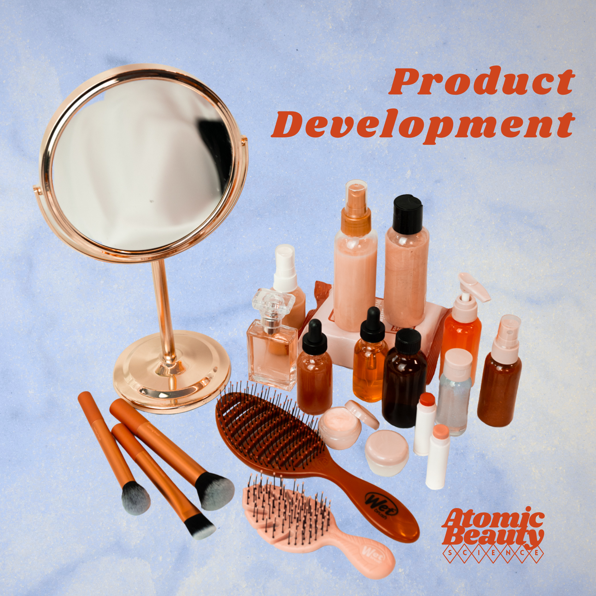 Array of beauty products and tools including bottles, sprays, brushes, and mirrors with the text 'Product Development' and 'Atomic Beauty Science' on a light blue background.