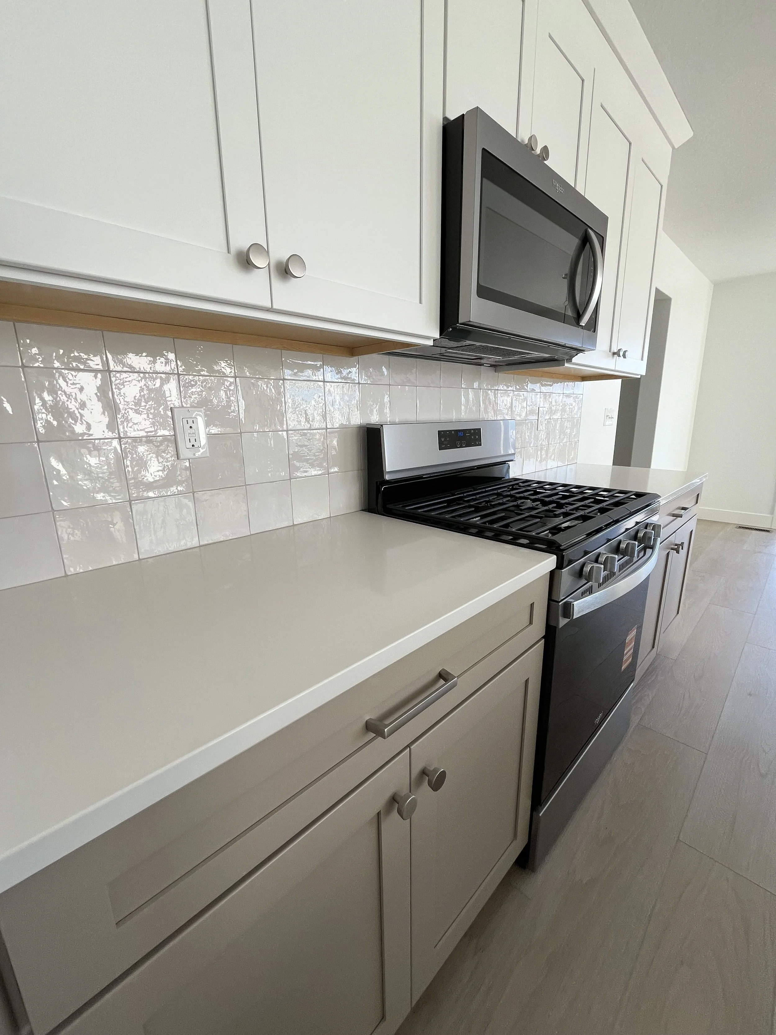 Backsplash and hardware details on a finished kitchen remodel