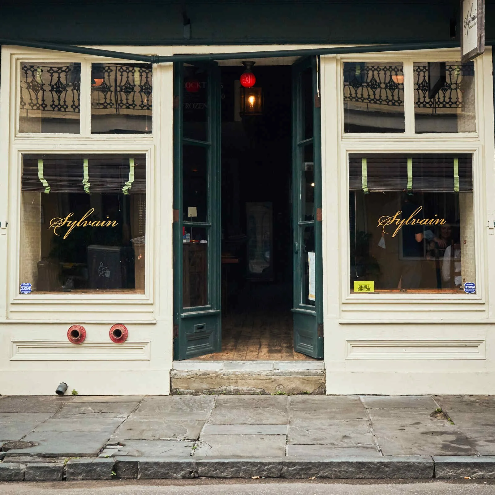 Picture of the store front of Sylvain restaurant on Chartres St in the French Quarter of New Orleans