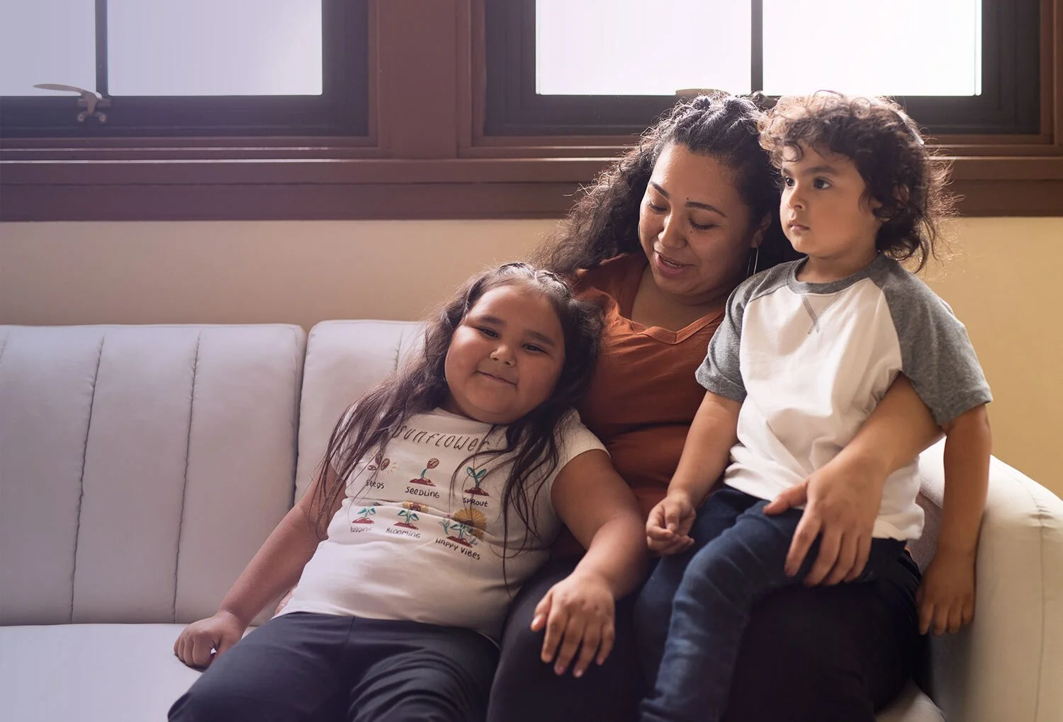 Smiling Oakland mother with young daughter and son