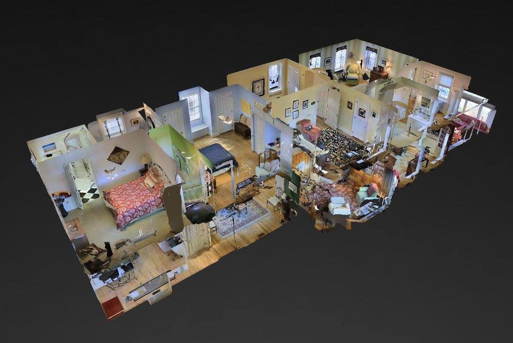 3D floor plan of an apartment with multiple rooms, including bedrooms, living room, and kitchen.