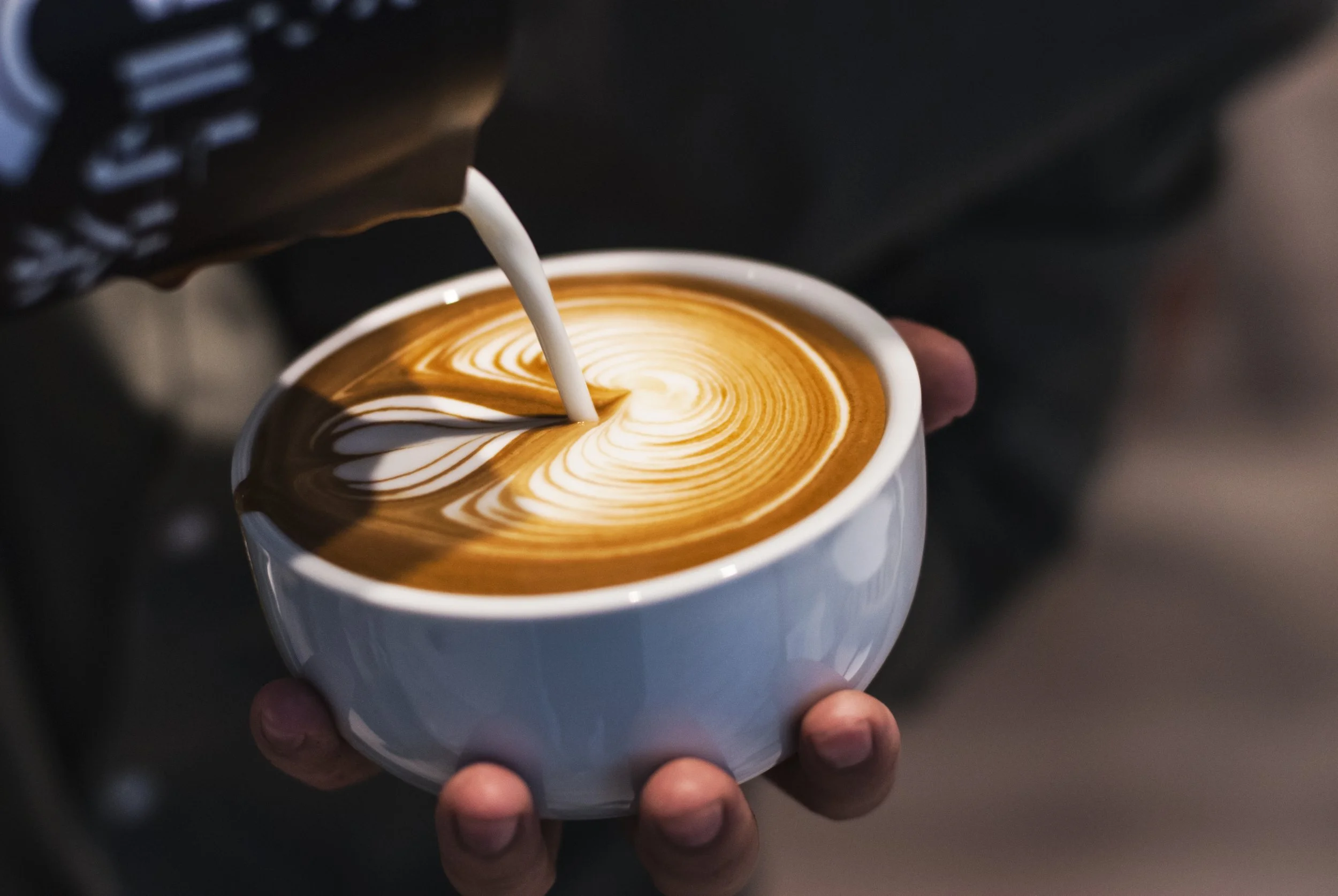 Aromatic coffee poured with velvety milk