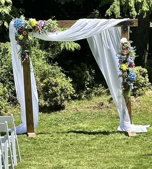 Wood Arch $100 (Drapes and Flower extra)