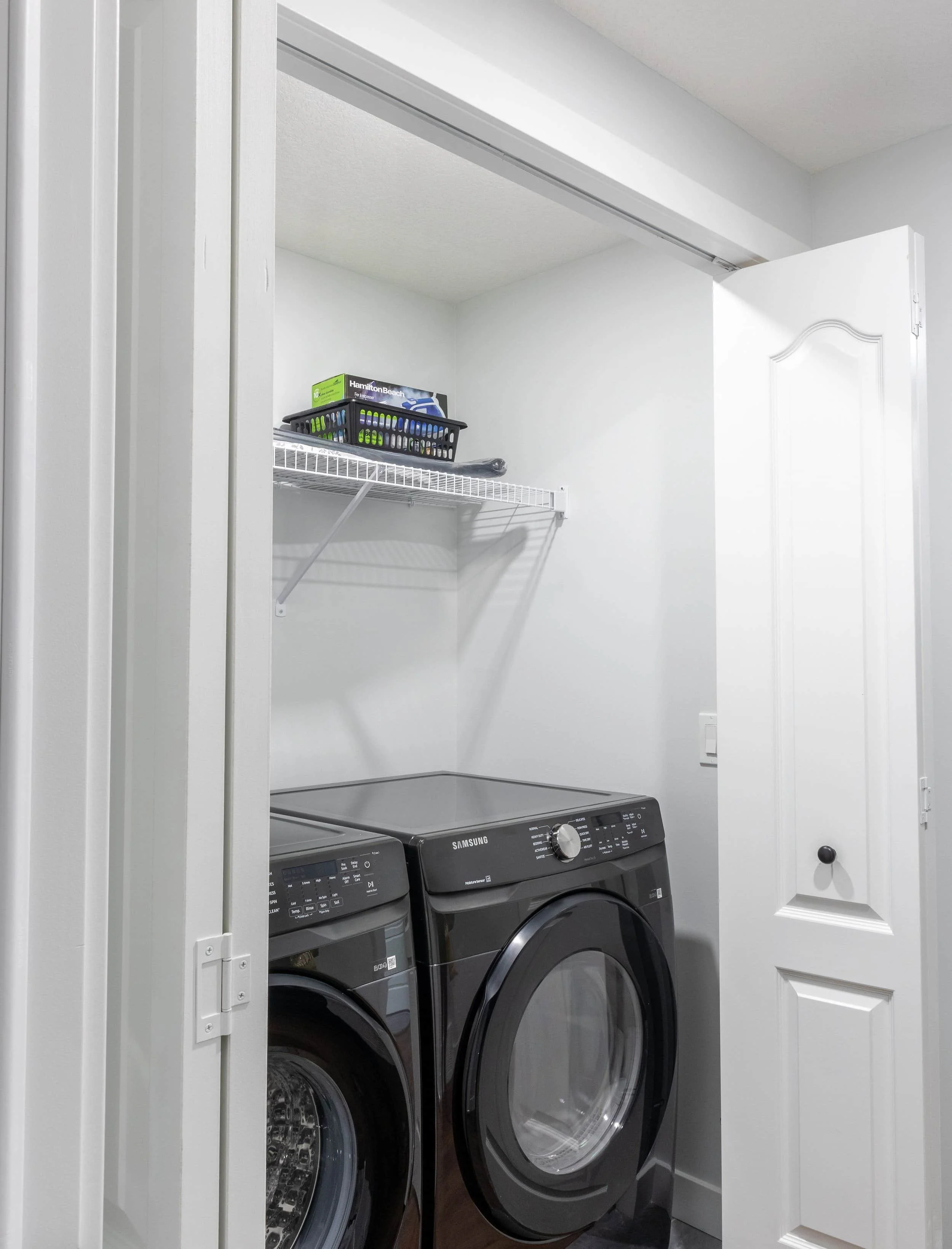samsung-charcoal-grey-front-load-washer-dryer-in-white-laundry-closet.jpg