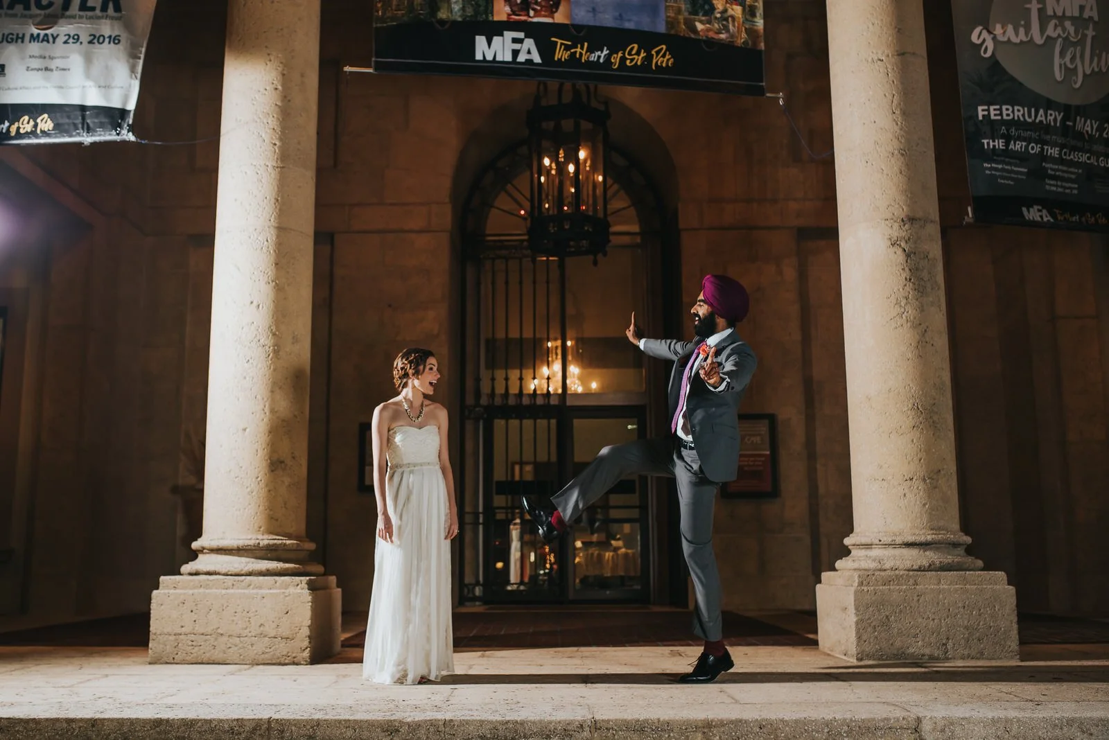 indian wedding couple dancing in front of museum of fine arts st. petet of