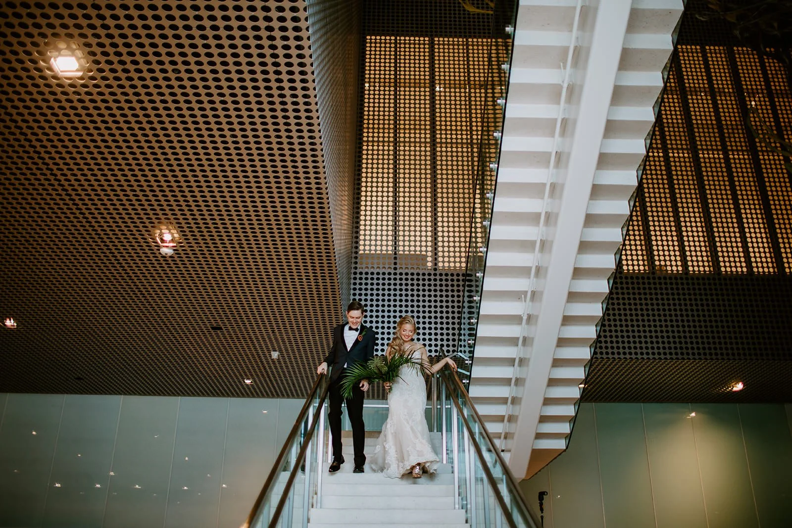 wedding couple at tampa museum of art coming into reception
