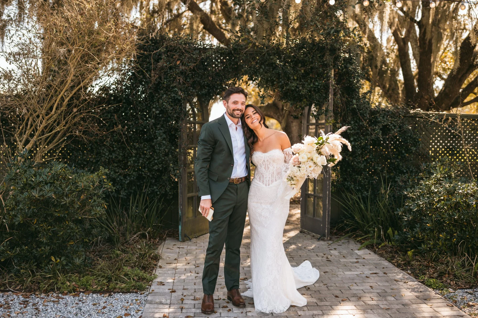 wedding couple in courtyard at Mill Pond estate saying personal vows