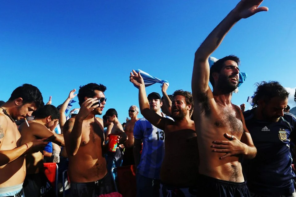 A photojournalistic journey through the crowds, emotion, and electric atmosphere of the 2014 World Cup, captured by Jane Stockdale and Damian Platt.