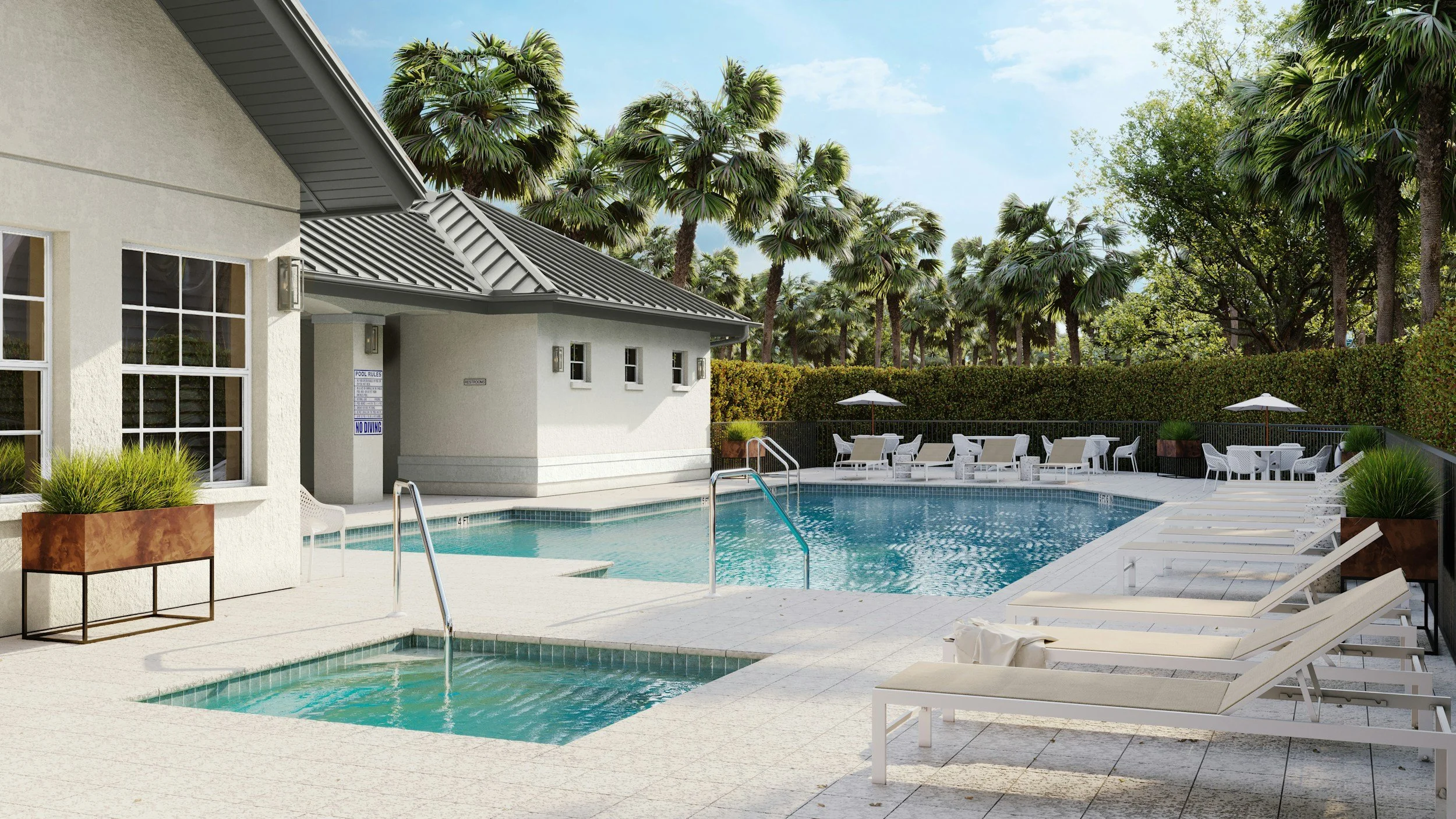 An outdoor swimming pool area with lounge chairs, umbrellas, and a surrounding lush green palm Tree landscape under a blue sky.