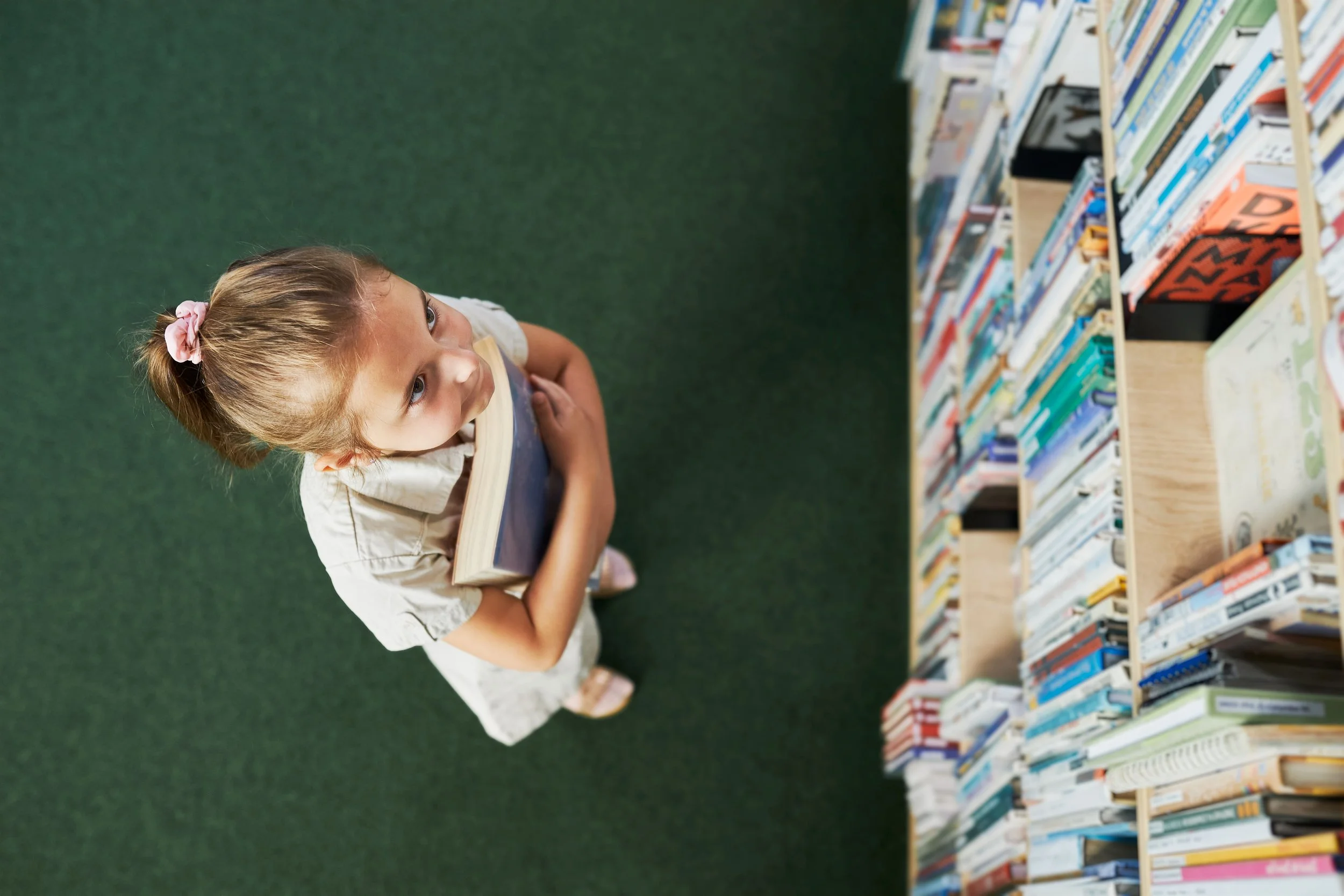 student-looking-top-bookshelf-school-library-smart-girl-selecting-books-back-school-min.jpg