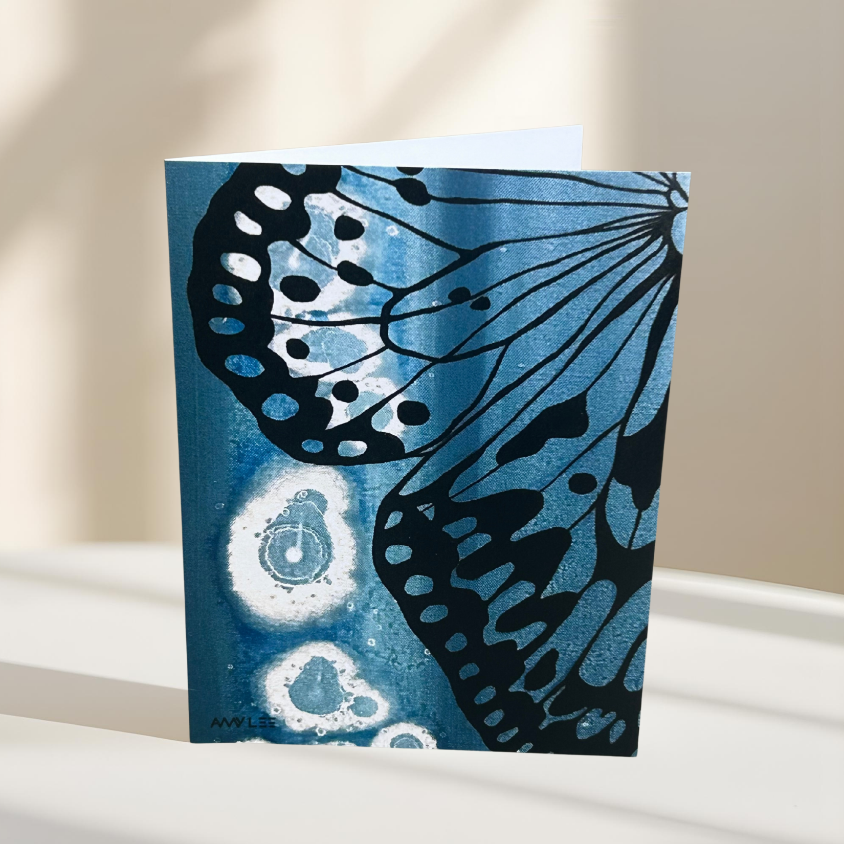 Blue silhouette butterfly wing card_Light.png