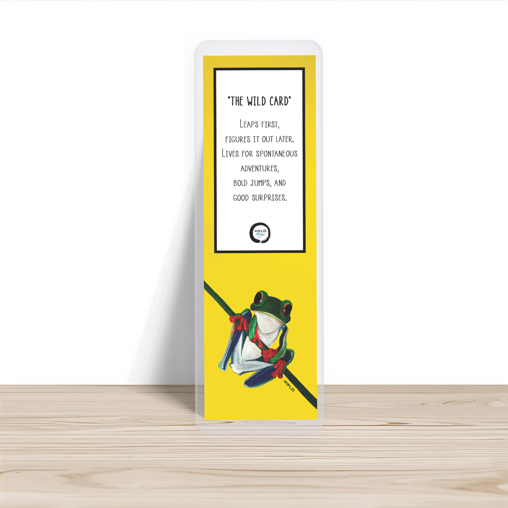 Tree Frog_Yellow_Bookmark_Single, Wooden table.png