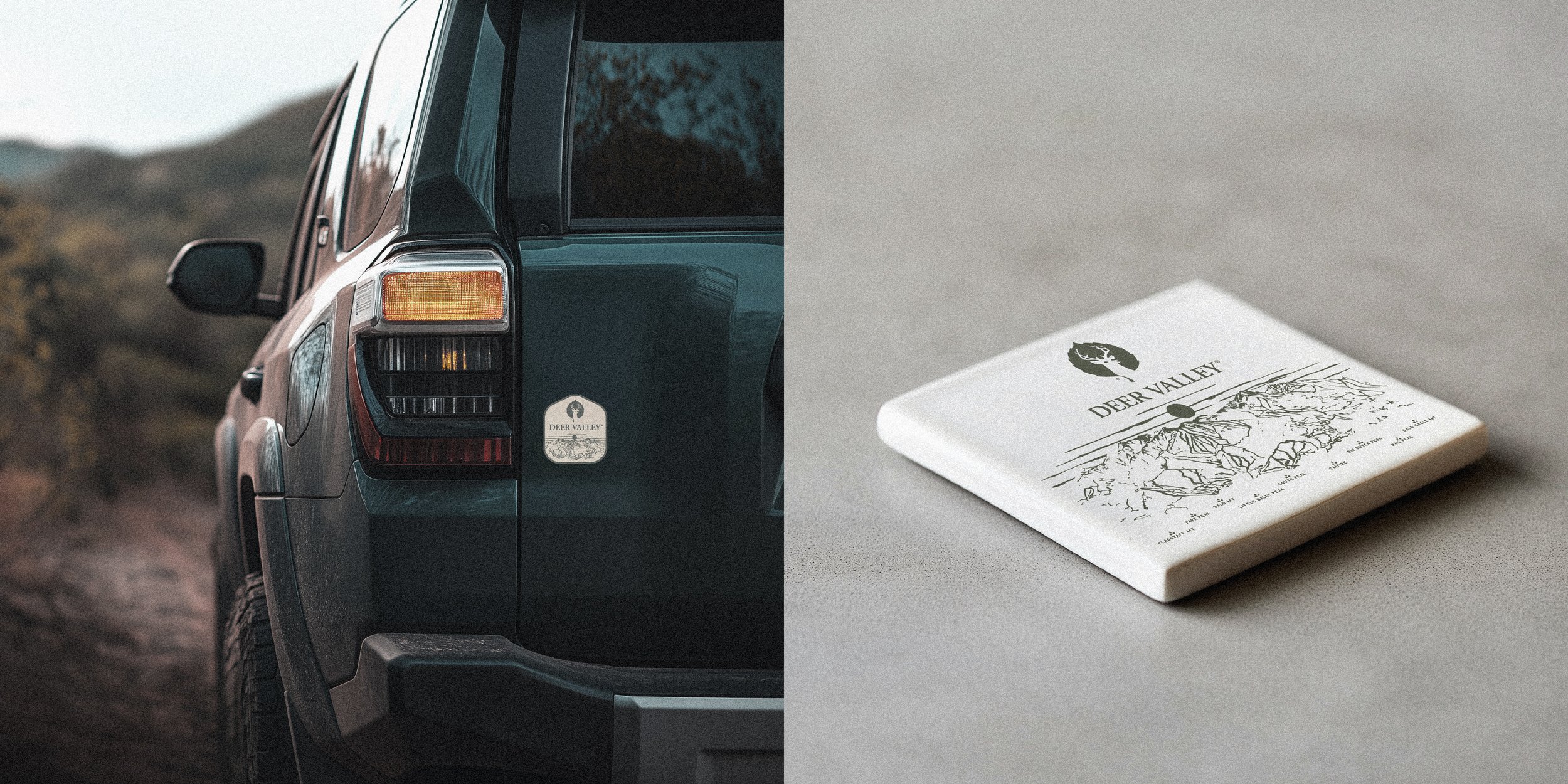 A dark green vehicle with a Deer Valley sticker and a white branded coaster on a table or surface.