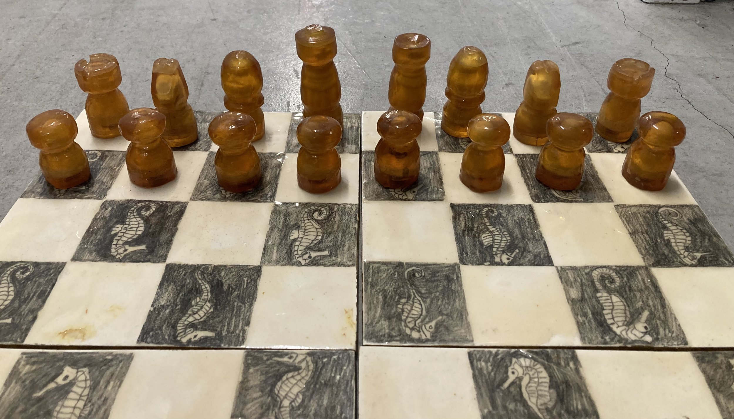 set of chess pieces (traditional pieces encased)