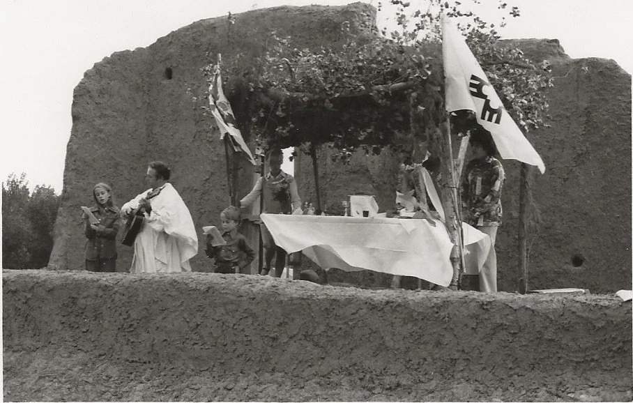 Celebrating mass at Santa Rosa de Lima de Abiquiu Mission ruin, Abiquiu, NM. August 1, 1976.
