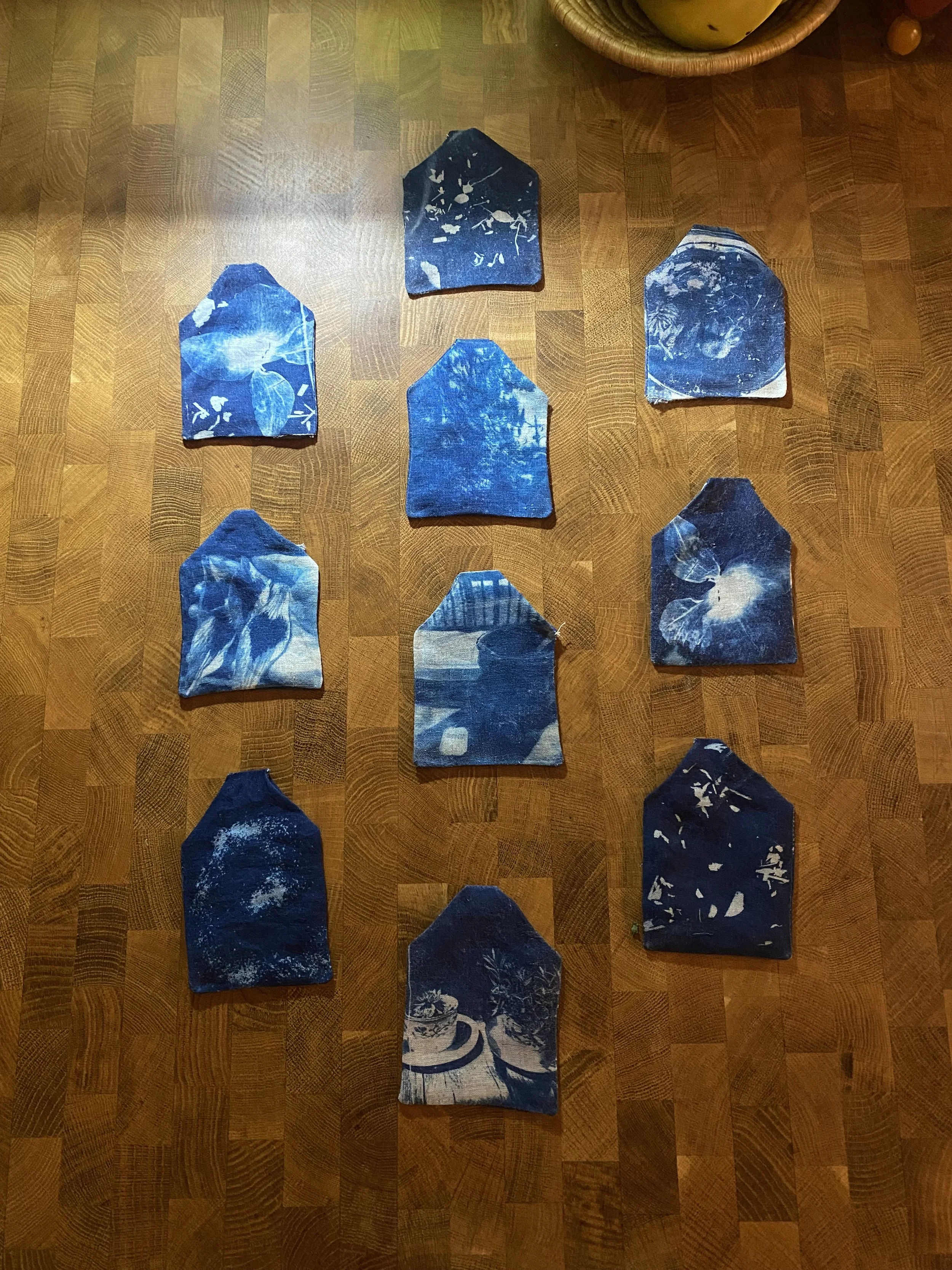 10/50 tea bags that I individually cut,  cyanotyped, and sewed! 