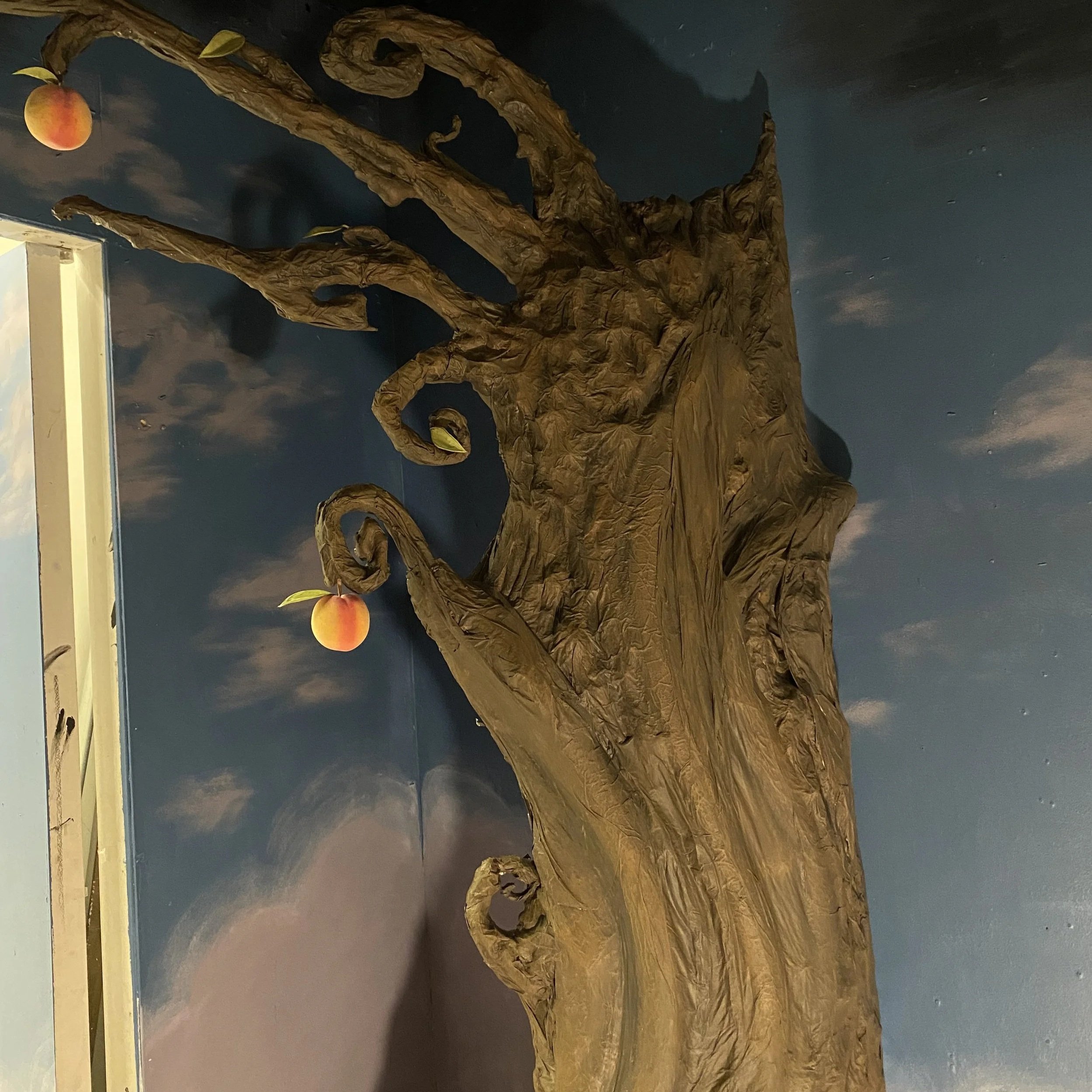 Base color and dimensional shading was layered. I sourced faux peaches and made leaves to add to the branches. 