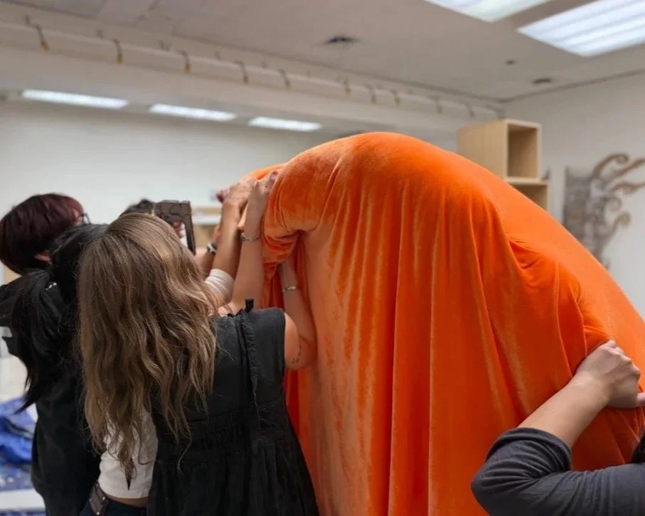 After covering the peach in chicken wire and artificial snow blanket, we tightly stretched velvet spandex over the entirety of the peach.