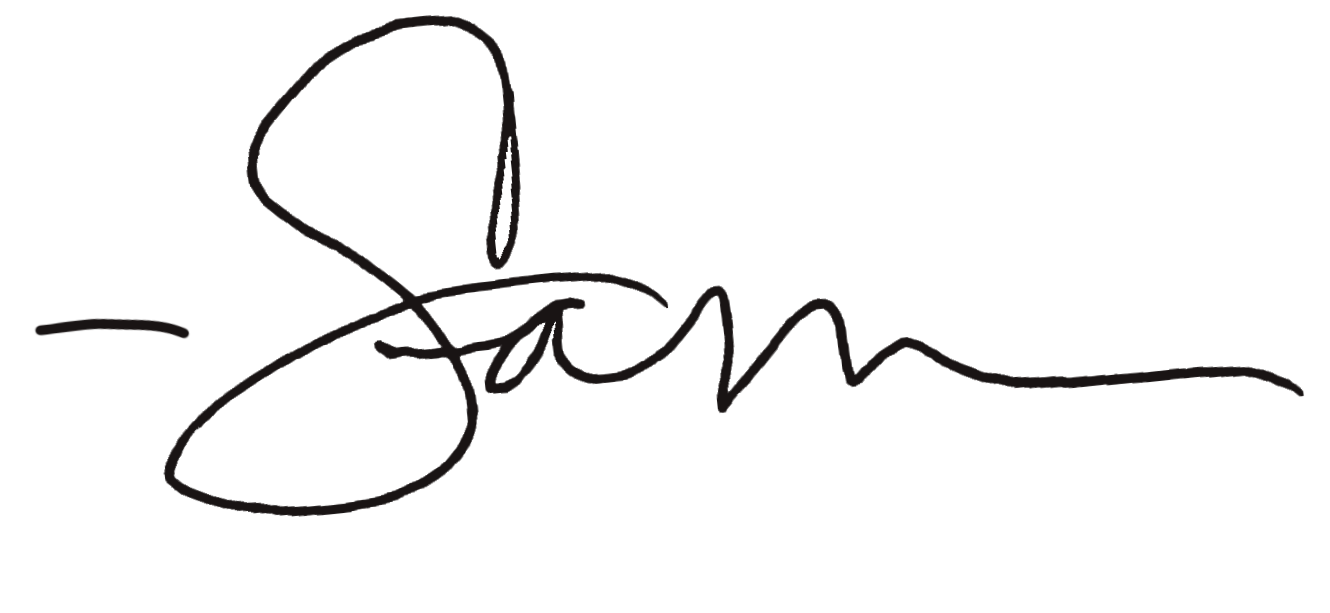 A black script signature on a white background.